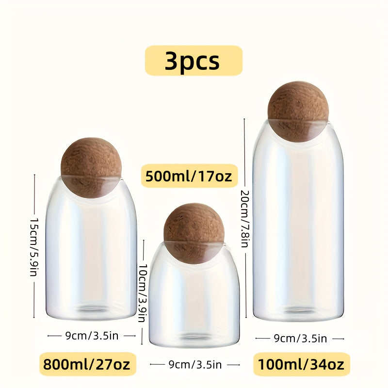 Set van 3 glazen opbergpotten met kurkdeksels.