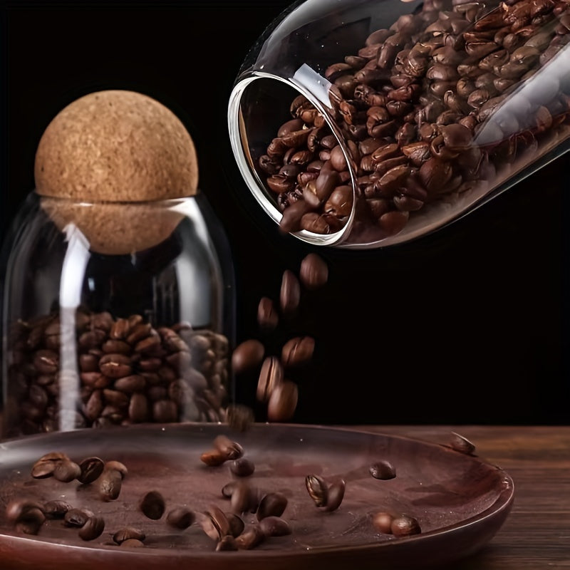 Set van 3 glazen opbergpotten met kurkdeksels.