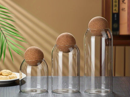 Set van 3 glazen opbergpotten met kurkdeksels.