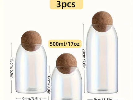 Set van 3 glazen opbergpotten met kurkdeksels.