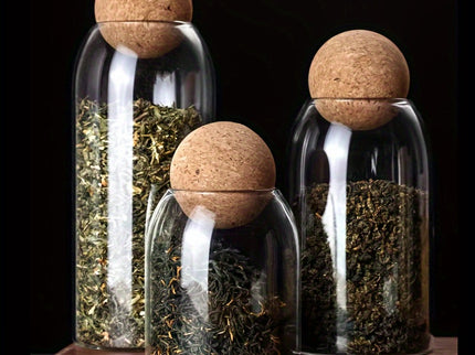 Set van 3 glazen opbergpotten met kurkdeksels.