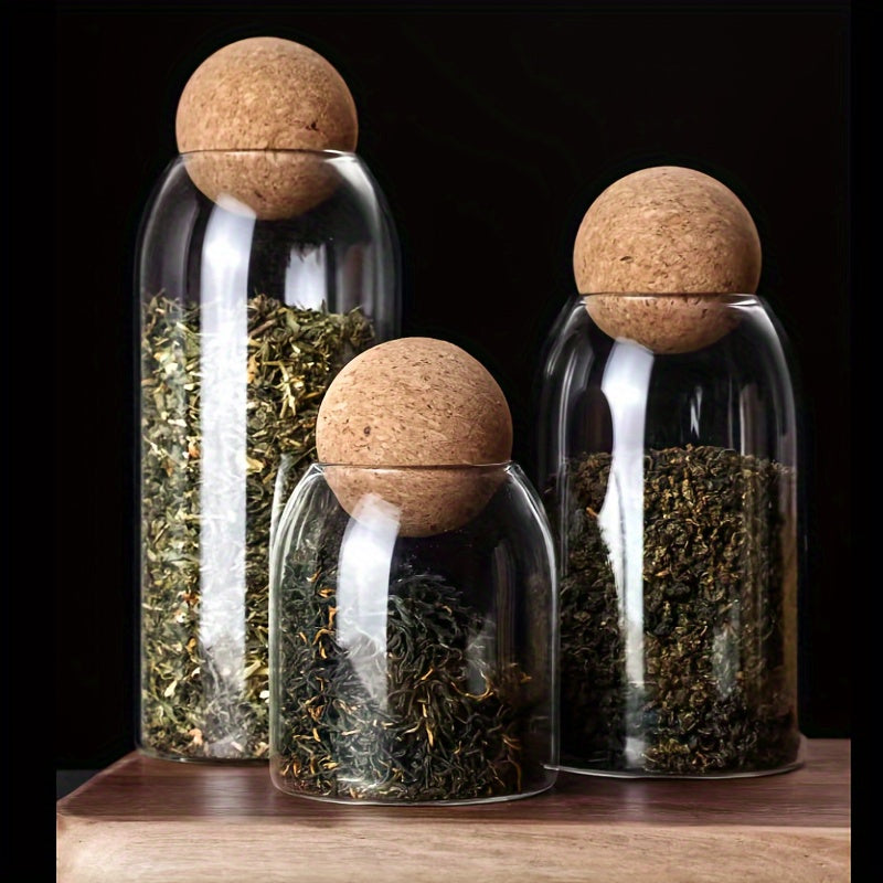 Set van 3 glazen opbergpotten met kurkdeksels.